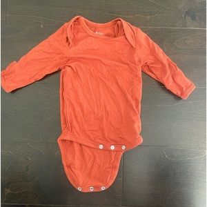 Kyte Baby Long Sleeve Bodysuit in Rust